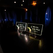 side view of custom acrylic light up table cards at a wedding