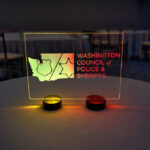 LED acrylic welcome table sign for Washington Council of Police & Sheriffs at a formal event