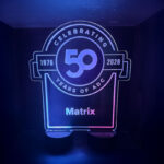 Custom LED acrylic centerpiece celebrating 50 Years of ADC personalized with Matrix at an anniversary gala