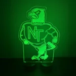 Cut-to-shape NT eagle mascot LED acrylic sign glowing green at a school sports banquet